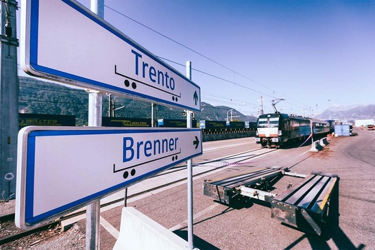 Train with signs in the forefront