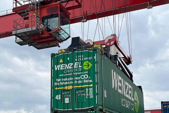 Gantry crane lifts container