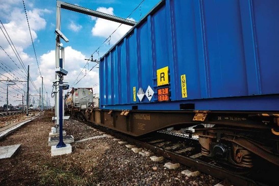 Freight train drives through video gate