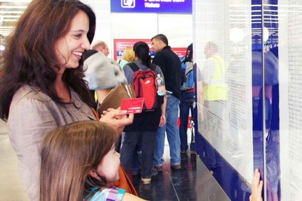 Customer viewing the timetable display.