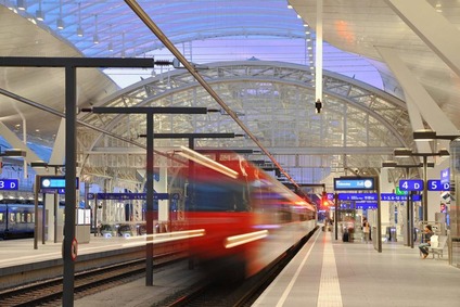 Station and incoming train at Salzburg Hauptbahnhof.