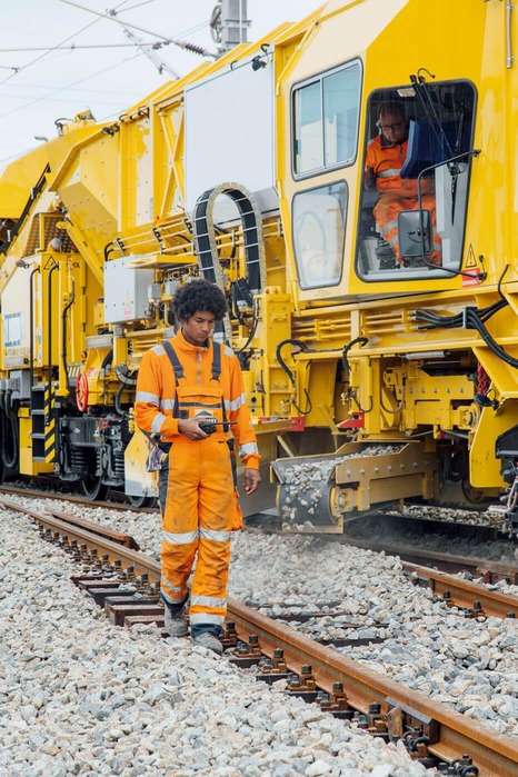 Two specifically trained skilled workers carry out repair work on several track sections.<br/>