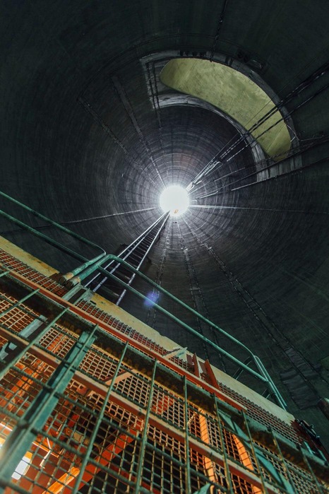 A miner walks along the tunnel.<br/>