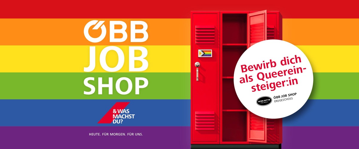 Roter Spind mit Aufschrift "Hier ist dein Job frei" bei Regenbogen Hintergrund