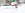 Ausflüge mit Kindern: 5 Tipps für gemeinsame Abenteuer im Schnee. Im Bild sieht man ein Kind, das sich hinter einem Schneemann versteckt. 