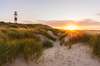 Zum Sylt Urlaub gehört der sogenannte Ellenbogen. Auf dem Bild sieht man den Leuchtturm an diesem Strand bei Sonnenuntergang. 