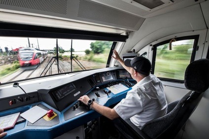 Train driver steering a train