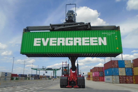 Stacker lifts container
