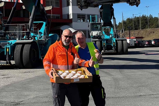 two people with carnival doughnuts