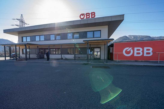 Building with canopy roof and ÖBB logo