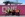 Eight people in front of a container 