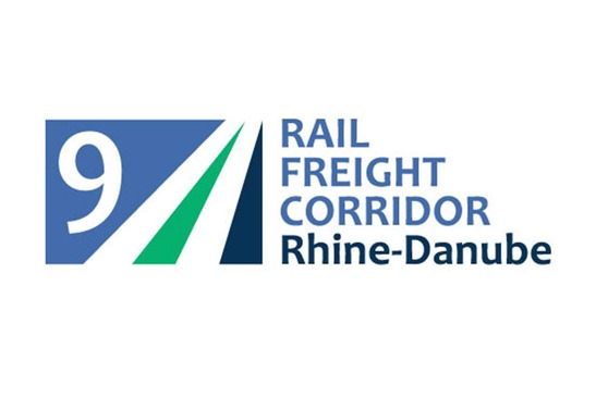 Logo RFC9<br/>Text insert: white background, RFC icon on the left in blue, green, white, blue RAIL FREIGHT CORRIDOR, below it gray Rhine-Danube