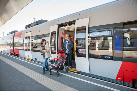 Passengers with prams getting off