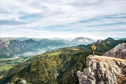 Hikers on the Gartnerkofel and view of the Gail Valley