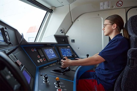 Railroad transport technology - apprentice sits in the locomotive