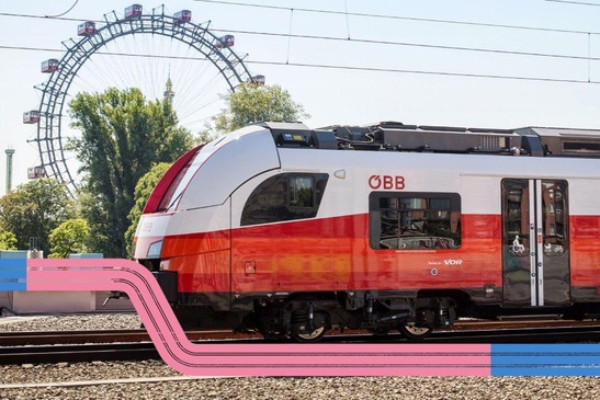 Cityjet beim Bahnhof Praterstern im Hintergrund das Riesenrad