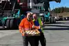 two people with carnival doughnuts