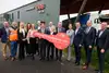 Group with symbolic key in front of the new terminal building