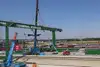The first new gantry crane is being installed. 