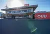 Building with canopy roof and ÖBB logo