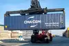 Crane vehicle loading a container