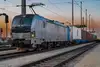 Freight train at terminal with sunrise