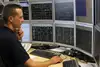 Dispatcher in front of several screens.