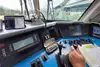 View from the driver's cab through the window, infradoas tablet on the left-hand side, hand on the control stick