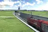 Train passing the airport loop Graz-Weitendorf.