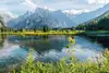 Text insert: Photo of mountains and lakes in Grünau im Almtal, view of Großer Priel in the Salzkammergut.