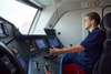 Railroad transport technology - apprentice sits in the locomotive