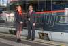 Apprenticeship mobility service - Two apprentices stand in front of the train