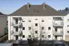 Textinsert: Foto Attnang-Puchheim, Dr. Karl Renner Platz, Außenansicht Wohnbau, hofseitig