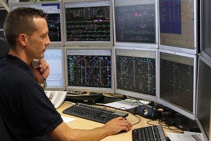 Dispatcher in front of several screens.