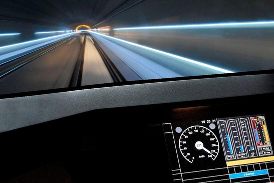 View from a locomotive with speedometer in the foreground