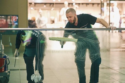 Cleaning glas at the railway station