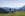 Familien-Weitwanderung im Gaistal - Familie steht auf Wiese mit Blick aufs Plateau Panorama