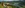 2 Personen rasten mit Blick auf den Walchsee