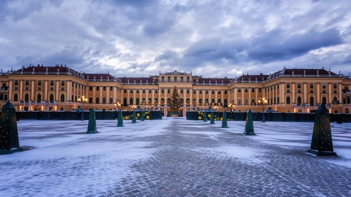 Schoenbrunn Palace in Christmas decorations at dusk with lights