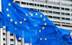 European flags fluttering in front of the Berlaymont Building