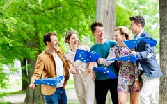 Friends in a park with European flags