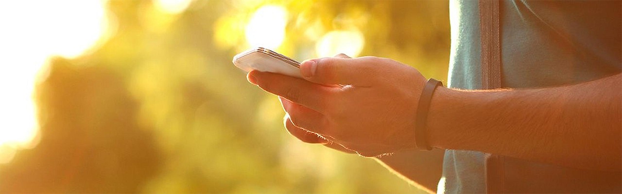 Man holds smartphone in his hands