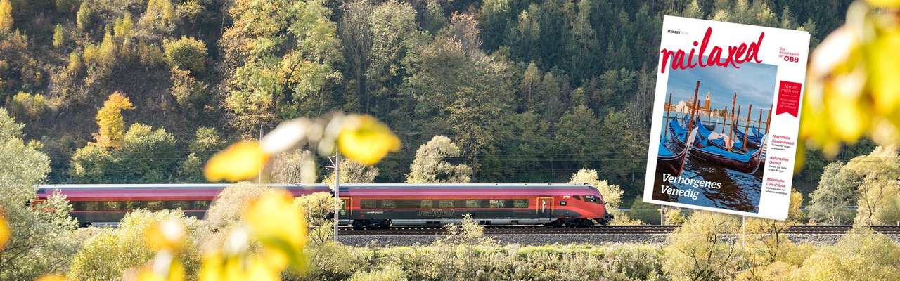 Railaxed Magazin mit Railjet im Hintergrund
