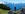 Hiker in front of a beautiful mountain panorama