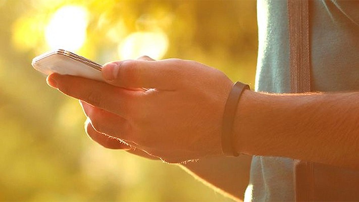 Man holds smartphone in his hands