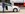Personen stehen vor Rail&Drive Auto