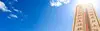 Thermometer mit Himmel im Hintergrund