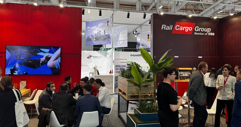 Rail Cargo Group exhibition stand at Logitrans with visitors in discussion and company branding visible