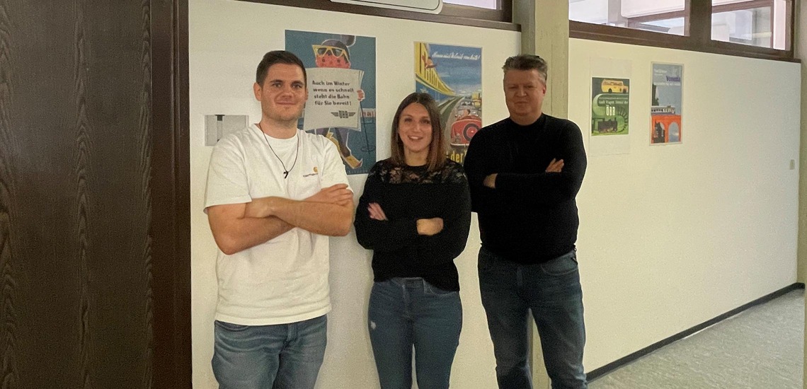 Customs team of Rail Cargo Group (RCG) in Wolfurt, three employees standing in an office hallway.