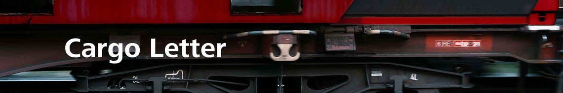 Close-up of a freight wagon undercarriage with wheels and the title “Cargo Letter” as newsletter banner